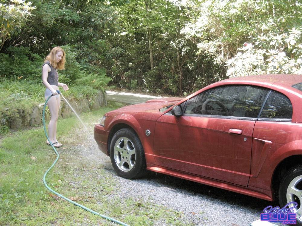 I am washing my old car. it is a 04 red mustang | Photo: 5096509