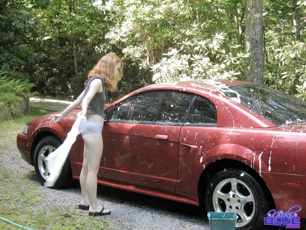 I am washing my old car. it is a 04 red mustang | Photo: 5096511