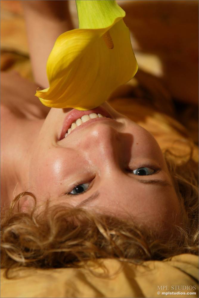 Masha P Is Lying On Silk Sheet And Gently Fondling Her Smooth Body With Yellow Flower - #5
