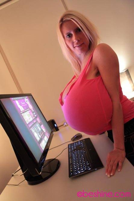 Beshine working on her site with a pink top - #3
