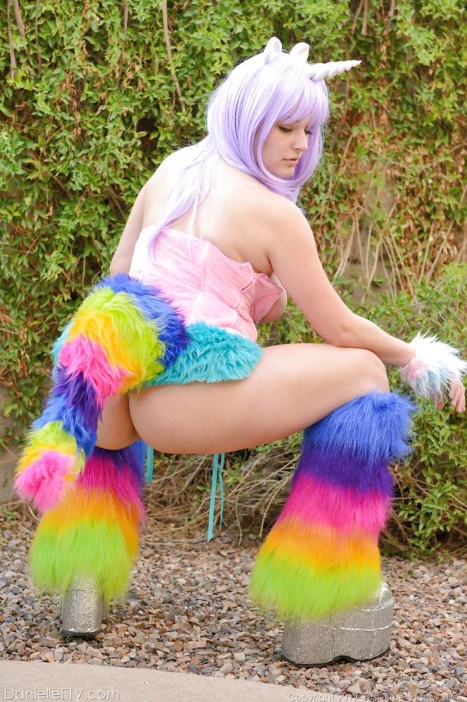 Excellent hottie Danielle Delaunay in cosplay costume baring big hooters and toying her pussy outdoor - #10