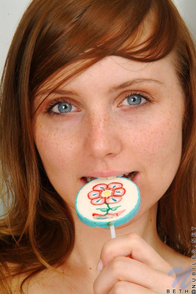 Red Haired Teen Babe Beth Nubiles Slowly Strips While Eating A Lollipop. - #13