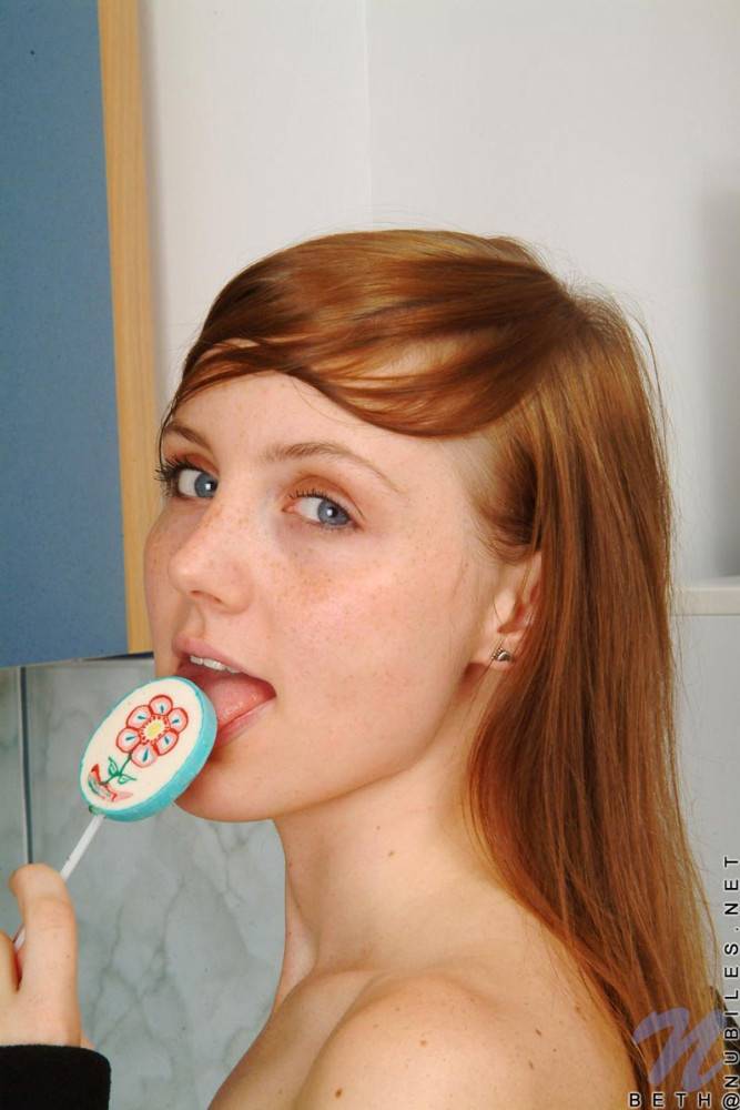 Red Haired Teen Babe Beth Nubiles Slowly Strips While Eating A Lollipop. - #9