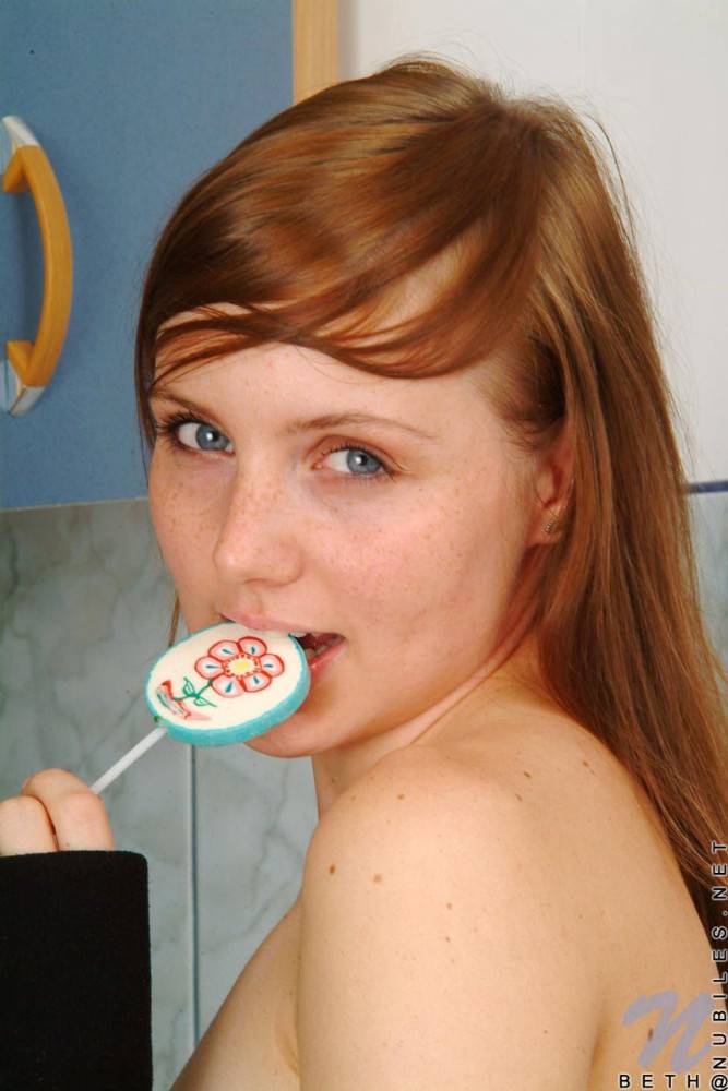 Red Haired Teen Babe Beth Nubiles Slowly Strips While Eating A Lollipop. - #10