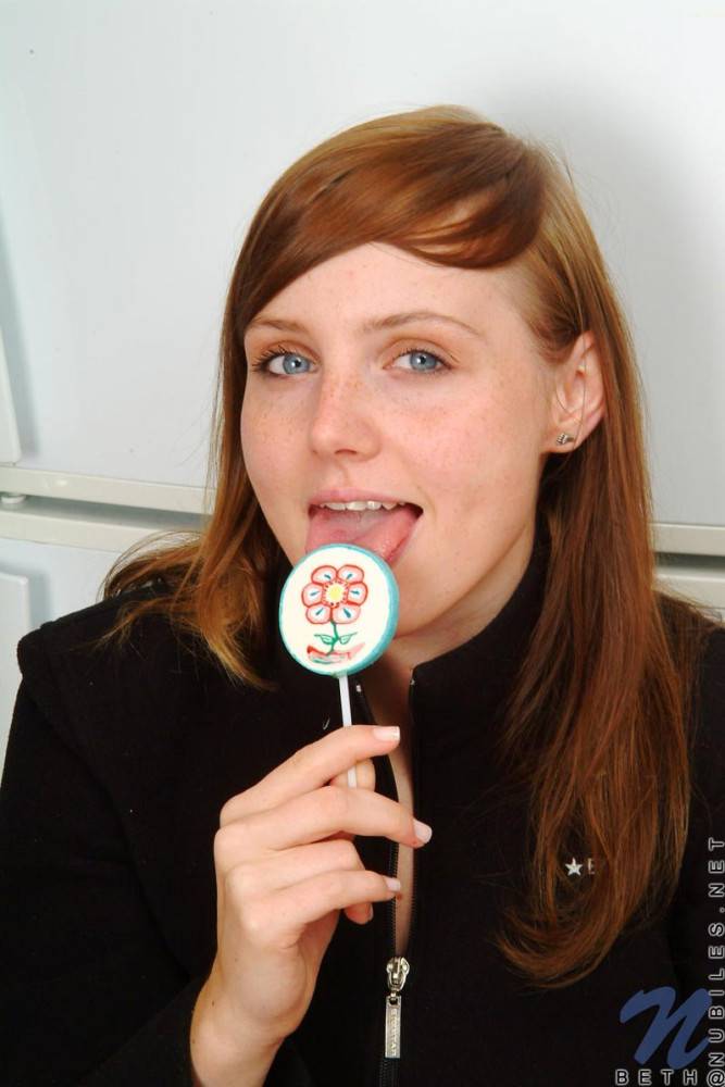 Red Haired Teen Babe Beth Nubiles Slowly Strips While Eating A Lollipop. - #1