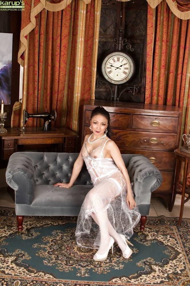 Glamorous oriental milf Aya May revealing big knockers and spreading her legs - #7