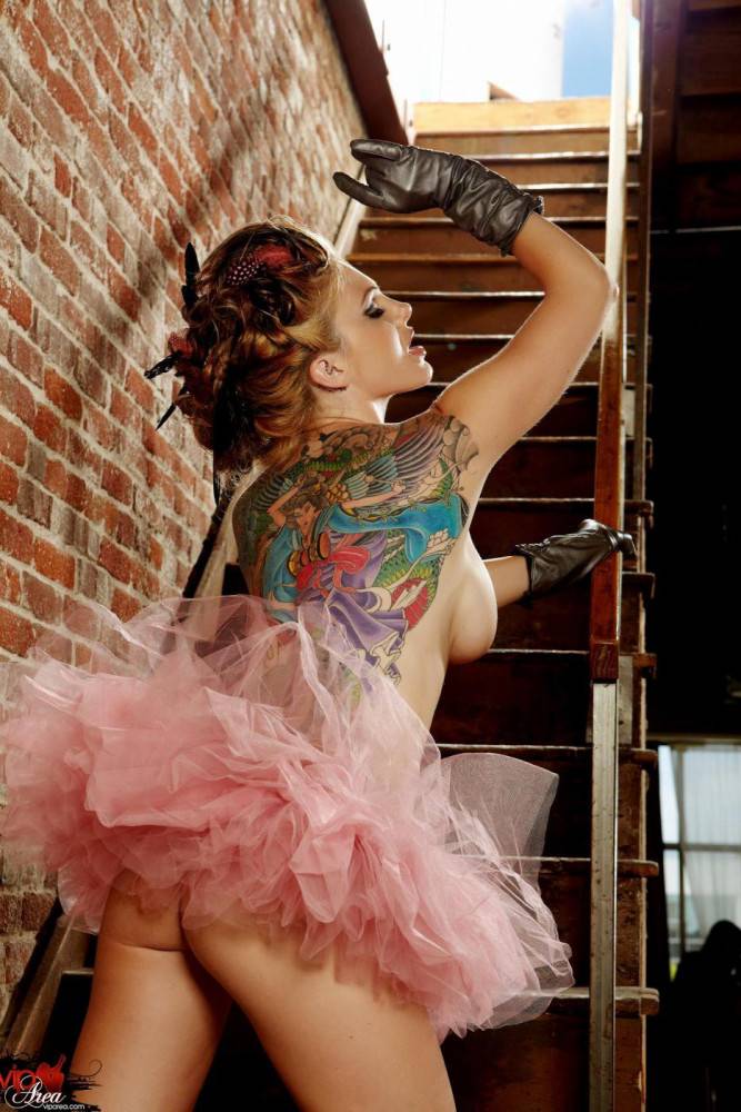 Tattooed Redhead With Big Boobs And Long Legs Jesse Capelli Poses On The Stairs - #1