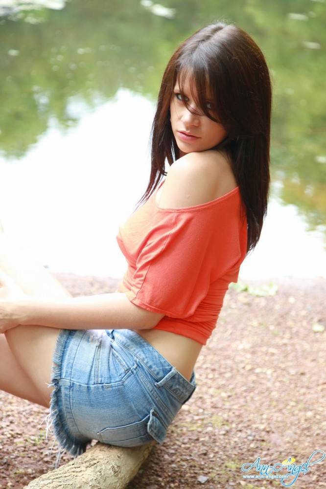 Sweet Ann Angel In Blue Jean Mini Skirt And Red T-shirt Spreads Poses On The Bank Of The River - #6