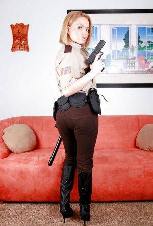 Hot babe in police uniform Krissy Lynn stripping and spreading her legs on pornstar6.com