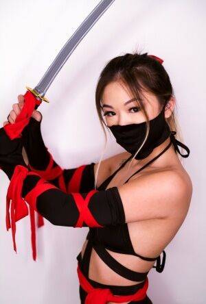 Petite Asian teen Lulu Chu wields a samurai sword before fucking on pornstar6.com