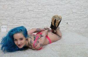 Tatted chick with blue hair is left hogtied in heels and her underwear on pornstar6.com