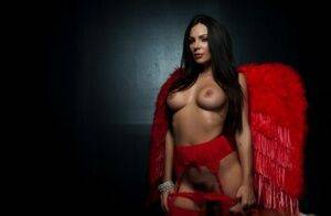 Alluring brunette MILF Kirsten Price frees her tits from a red bra on pornstar6.com