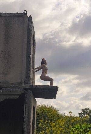 Natural redhead Elis B poses for a daring nude shoot in an derelict building on pornstar6.com