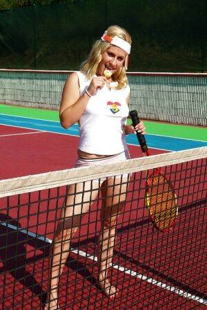 Sporty babe with big tits Angel B toying her cunt on the tennis court on pornstar6.com