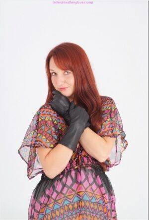 Natural redhead Sammy B model fully clothed in black leather gloves on pornstar6.com