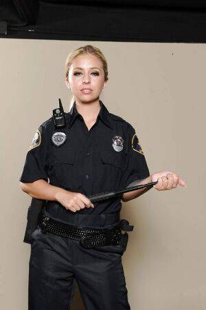Solo girl Madelyn Monroe releasing boobs from police uniform on pornstar6.com