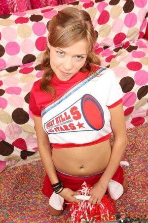 Teen cheerleader Nicole Ray shows off her perky tits and pink twat at halftime on pornstar6.com