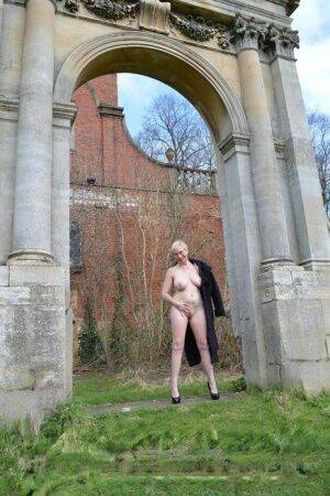 Mature blonde Barby Slut exposes herself during a walk around Bosworth hall on pornstar6.com