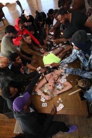 Platinum blonde slut gets gangbanged on a poker table by black men on pornstar6.com