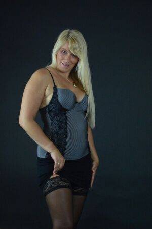 Blonde amateur Sweet Susi removes a black miniskirt before fingering fucking on pornstar6.com