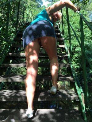 Blonde amateur Sweet Susi lifts her dress over her ass on outdoors stairs on pornstar6.com