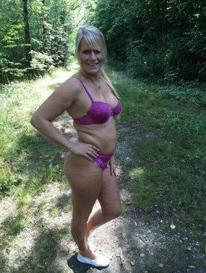 Chubby amateur MILF Sweet Susi sheds bikini bra to pose topless in the woods on pornstar6.com