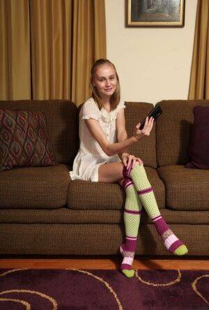 Adorable teen Alicia Williams takes a selfie before getting naked in OTK socks on pornstar6.com