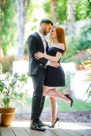 Pale redhead Ella Hughes seduces her man in a short black dress and heels on pornstar6.com