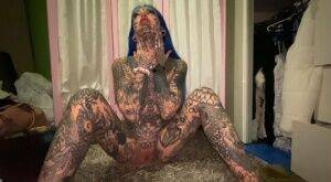 Alt girl shows her heavily inked body and tight pink pussy at once on pornstar6.com