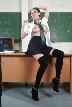 Clothed babe Connie Carter is showing off in a school uniform on pornstar6.com