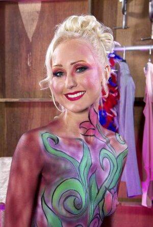 Hot older blonde Natasha Voya rocks it out wearing body paint only on pornstar6.com