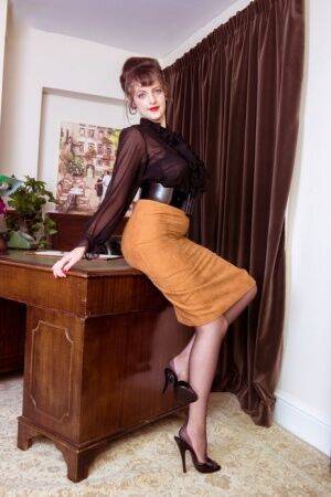 Long legged Kate Anne poses on the desk flaunting her vintage silk stockings on pornstar6.com