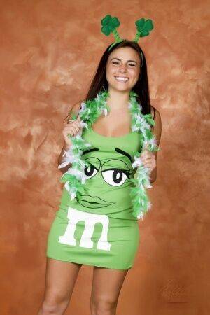 Amateur Kaley Kade flashes while wearing a green M&M dress on St Patty's Day on pornstar6.com