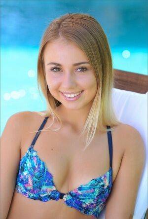 Sweet wild teen in bikini shows her tiny tits and bald twat by the pool on pornstar6.com