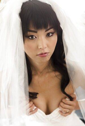 Hot Asian pornstar Marica Hase posing topless in wedding dress on pornstar6.com
