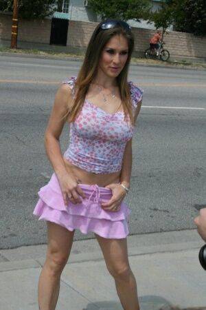 MILF babe in a shirt skirt Felony shows her big boobs outdoor on pornstar6.com