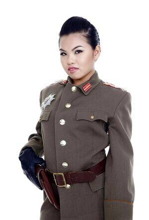 Oriental pornstar Cindy Starfall posing solo in military garb on pornstar6.com
