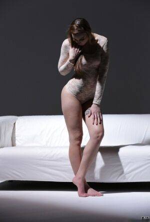 Bare legged solo model Lulu Love shows off her pretty feet in a onesie on pornstar6.com