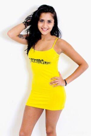 Latina teen Giselle Mari removes a yellow spaghetti strap dress to pose nude on pornstar6.com