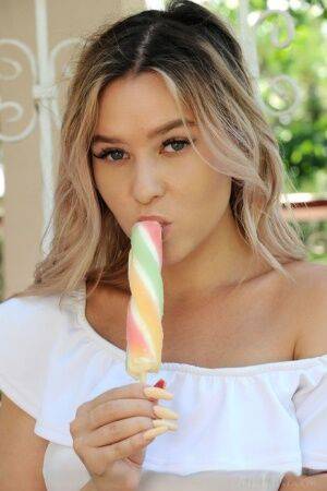 Dirty blonde teen Angelina Ash eats a frozen treat while getting totally naked on pornstar6.com