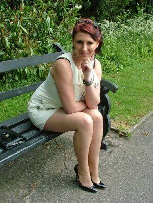 Thick woman in glasses shows off her stiletto heels on a park bench on pornstar6.com