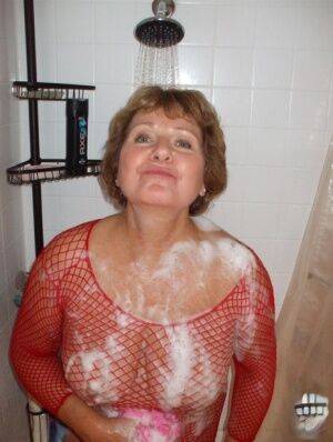 Older woman Busty Bliss soaps up her breasts before having her pussy licked on pornstar6.com