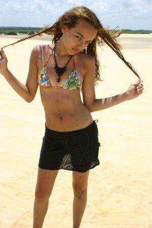 Latina teen Miranda Mirelli models in a bikini atop a sand dune on pornstar6.com