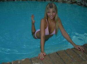 Blonde amateur Jana Jordan models a bikini while in an indoor swimming pool - Jordan on pornstar6.com