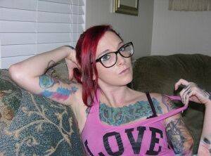 Tattooed redhead Lola takes off her glasses and clothes for her first nudes on pornstar6.com