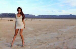 Hot solo model Jayden Cole smokes a cigarette while flashing in the desert on pornstar6.com