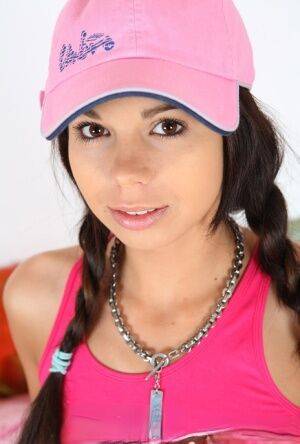 Cute teen Kiki 18 sports pigtails and a ballcap while having sex on a bed on pornstar6.com