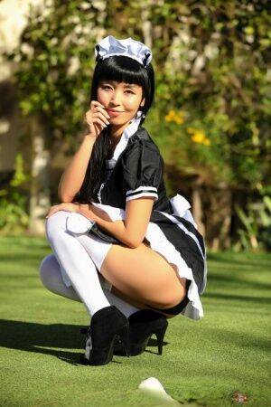 Japanese maid Marica Hase exposes her tits and twat on a putting green - Japan on pornstar6.com