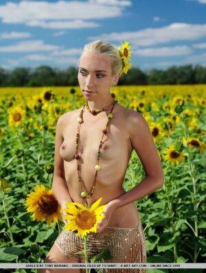 Amidst a large field of sunflowers in full bloom, Adele&39s natural beauty is on pornstar6.com