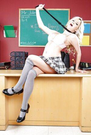 Impressive babe in sexy uniform Sienna Day poses in classroom on pornstar6.com